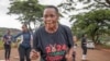 Mellisa Sachitongo, 65, exercises with the Commandos Fitness Club at the Warren Hills cemetery in Harare, Zimbabwe, Saturday, Jan. 18, 2025. ( AP Photo/Aaron Ufumeli)