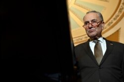 Senate Minority Leader Sen. Chuck Schumer of N.Y. listens during a news conference on Capitol Hill in Washington, Feb. 25, 2020.