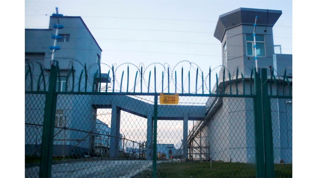 FILE - A perimeter fence is constructed around what is officially known as a vocational skills education center in Dabancheng in Xinjiang Uyghur Autonomous Region, China, Sept. 4, 2018.