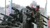 FILE - An Indonesian soldier cleans up a missile launcher during a military exhibition in Jakarta.