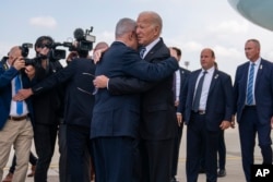 FILE - President Joe Biden is greeted by Israeli Prime Minister Benjamin Netanyahu after arriving at Ben Gurion International Airport, Wednesday, Oct. 18, 2023, in Tel Aviv.