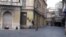 Bosnia and Herzegovina--Downtown before curfew, street Titova, Eternal fire--Sarajevo during the COVID19 pandemic, 14 April 2020.