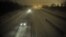 Motorists travel slowly on a snow-covered Interstate 24 during a winter storm in Paducah, Kentucky, December 26, 2012. 