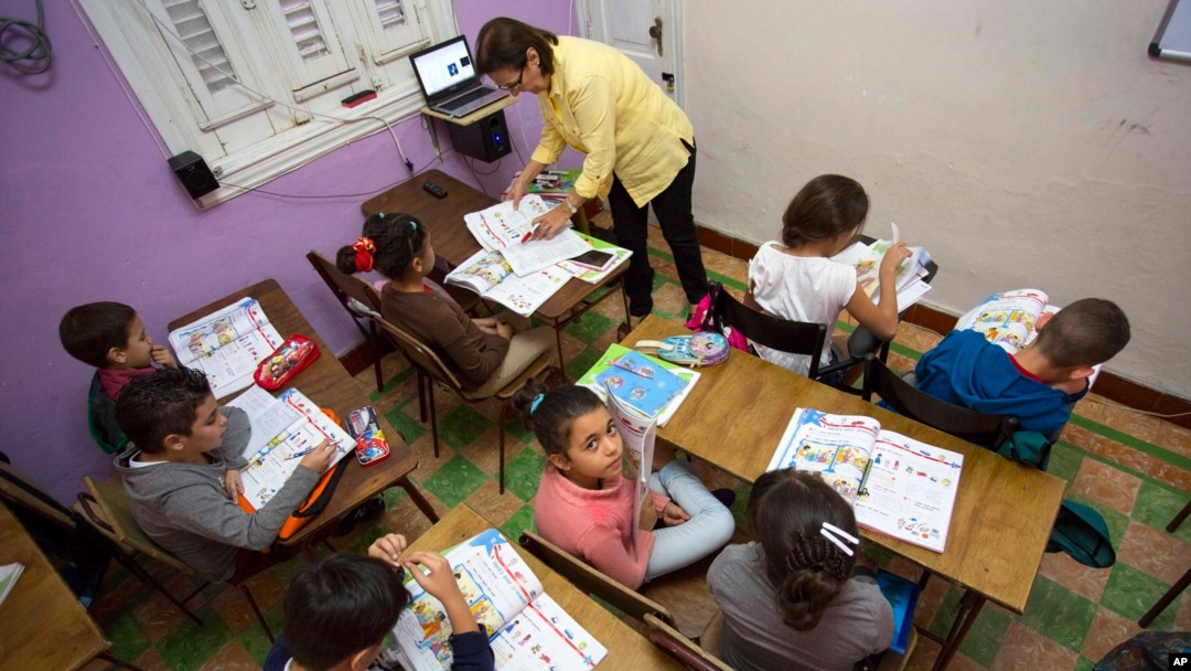 FILE - Students attend an English class at the Cuban School of Foreign Languages, in Havana, Cuba, Feb. 5, 2016. Despite ideological and legal hurdles, Cuba’s blooming entrepreneurial system has quietly created something that looks very much like a privat