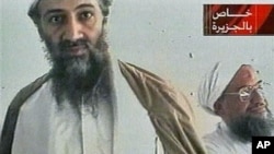 Al-Qaida leader Osama bin Laden is shown with top lieutenant, Ayman Al-Zawahri, in an image taken from a videotape broadcast on Al-Jazeera, October 2001. (file photo)