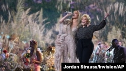 Jennifer Lopez performs with her mother, Guadalupe Rodríguez, at "Vax Live: The Concert to Reunite the World" on Sunday, May 2, 2021, at SoFi Stadium in Inglewood, Calif. (Photo by Jordan Strauss/Invision/AP)