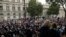 Anti-Brexit supporters gather outside the Prime Minister's residence 10 Downing Street in London, Wednesday, Aug. 28, 2019.