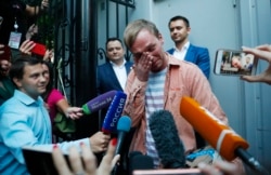 Prominent Russian investigative journalist Ivan Golunov, cries as he leaves a Investigative Committee building in Moscow, Russia, June 11, 2019.