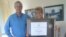 VOA's Moscow Bureau chief, Jim Brooke, presented Irina Donskaya the Gold Medal Award in 2010 for her exemplary contributions to the mission of the Voice of America. 