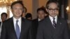 China's Foreign Minister Yang Jiechi (L) walks with his Indonesian counterpart Marty Natalegawa after a bilateral meeting at the Foreign Ministry office in Jakarta, August 10, 2012.