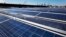 FILE - A rooftop is covered with solar panels at the Brooklyn Navy Yard in New York, Feb. 14, 2017.