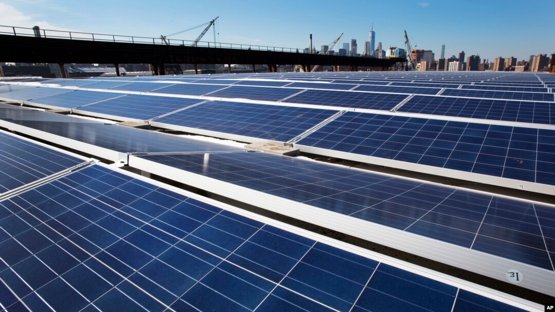 FILE - A rooftop is covered with solar panels at the Brooklyn Navy Yard in New York, Feb. 14, 2017.