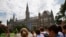 FILE - Prospective students tour Georgetown University's campus in Washington, July 10, 2013. 