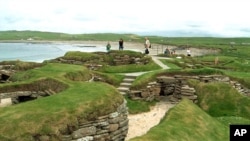 Visitors look at the 5,000 year-old remains of Skara Brae village in the Scottish Orkney Islands, July 19, 2005. ( AP Photo/Naomi Koppel)