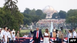 WASHINGTON, DC - JULY 04: President Donald Trump and first Lady Melania Trump walk along the South Lawn during an event at the White House on July 04, 2020 in Washington, DC. President Trump is hosting a "Salute to America" celebration that includes…