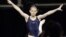Kyla Ross leaps from the balance beam during practice for the U.S. Olympic gymnastics trials, June 27, 2012, in San Jose, California.
