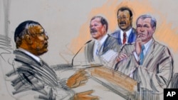 FILE - In this artist's rendering, U.S. District Judge Reggie Walton, left, presides over a case in Washington on March 5, 2007. Walton said recently about political violence, “We’re in a real difficult time in our country, and I hope we can survive it.”