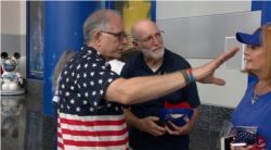 Volunteer Ty Patton directs rally-goers at the Trump Re-election Launch on June 18, 2019. (VOA video grab)