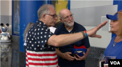 Volunteer Ty Patton directs rally-goers at the Trump Re-election Launch on June 18, 2019. (VOA video grab)