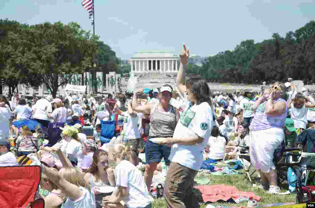A man, holding a national flag with a poster of Turkey's founder Kemal Ataturk, watches as thousands of Turks clash with security as they try to break through barricades mounted around the prison and courthouse complex in Silivri, in the outskirts of Istanbul.