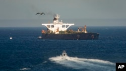 A supertanker hosting an Iranian flag is seen on the water in the British territory of Gibraltar, Sunday, Aug. 18, 2019. 