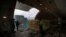 FILE - Air France cargo workers load equipment and pharmaceutical containers in a cargo plane at Roissy airport, outside Paris, Nov. 25, 2020, as the company is preparing for the transport of COVID-19 vaccines.