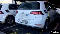 FILE - Electric cars are being recharged in Oslo, Norway, Jan. 2, 2019.