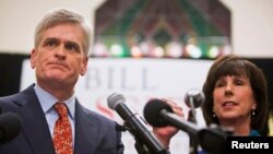 Republican U.S. Representative Bill Cassidy addresses supporters with his wife Laura after winning the runoff election for U.S. Senate against Democrat Mary Landrieu in Baton Rouge, Louisiana, Dec. 6, 2014. 