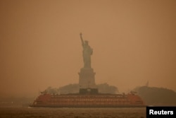 FILE - The Statue of Liberty is covered in haze and smoke caused by wildfires in Canada, in New York U.S., June 6, 2023. (REUTERS/Amr Alfiky/File Photo)