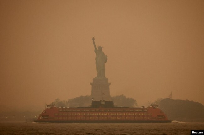 FILE - The Statue of Liberty is covered in haze and smoke caused by wildfires in Canada, in New York U.S., June 6, 2023. (REUTERS/Amr Alfiky/File Photo)