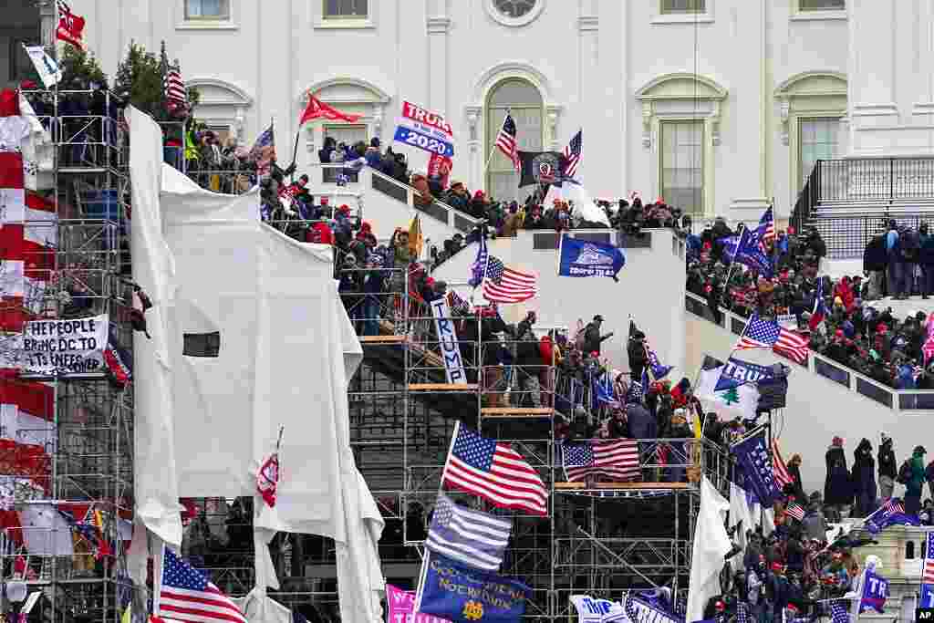 Trump supporters gather outside the Capitol, Jan. 6, 2021, in Washington.