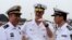 Robert L. Thomas Jr. (C), Commander of the U.S. Seventh Fleet talks with Chinese general Yuan Yubo (L) at a port in Qingdao, during the U.S. Seventh Fleet Flagship USS Blue Ridge (LCC 19) visit to China, Shandong province, August 5, 2014.
