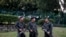 FILE - Police officers stand guard outside a Shah Alam court house at Shah Alam outside Kuala Lumpur, Malaysia on Friday, July 28, 2017.