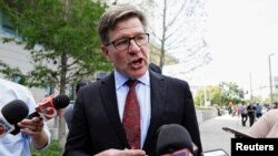 FILE - Attorney Charles Swift speaks with media outside a federal courthouse following the acquittal of his client, Noor Salman, the widow of the Pulse Nightclub gunman in Orlando, Fla., March 30, 2018.