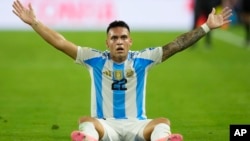 Argentina's Lautaro Martínez celebrates scoring his side's first goal against Colombia during the Copa America final soccer match in Miami Gardens, Fla., July 14, 2024. 