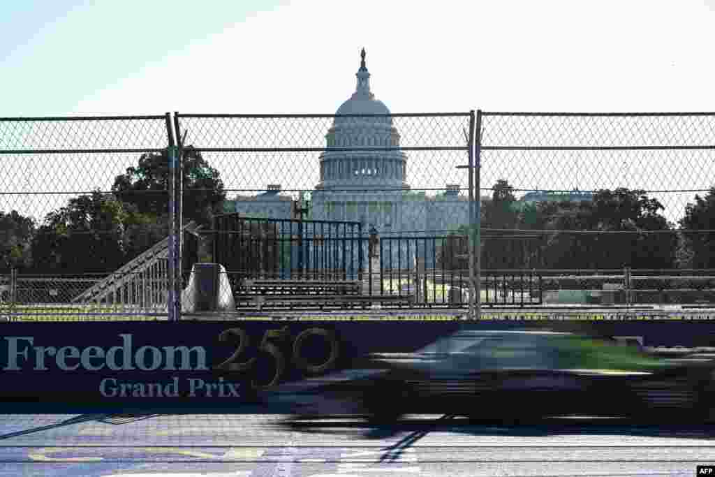 A car races past the US Capitol during warm up ahead of the IndyCar Freedom 250 Grand Prix in Washington, DC, on August 23, 2026.