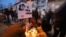 People attend a commemoration in Kosice, Slovakia, Feb. 21, 2020, to mark the second anniversary of the slayings of an investigative reporter and his fiancee. Jan Kuciak and Martina Kusnirova were shot dead in their home. 