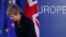 FILE - British Prime Minister Theresa May leaves after addressing a media conference at an EU summit in Brussels, March 22, 2019. 