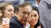 FILE - Los Angeles Clippers owner Donald Sterling, center, and V. Stiviano, right, watch the Clippers play the Sacramento Kings.