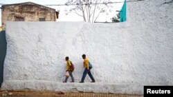 Students walk within the walled city of Harar, Ethiopia, Feb. 24, 2017. 