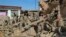 In this photo released by Xinhua News Agency, soldiers clear debris on the damaged houses after the earthquake in Chenjia Village of Dahejia Township, Jishishan County, northwest China's Gansu Province on Dec. 20, 2023. 