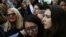 FILE - Woman embrace each other during a protest against President-elect Donald Trump in Manhattan, New York, Nov. 13, 2016. Feeling threatened by comments Trump made during the campaign, tens of thousands of women have pledged to march in Washington a day after his inauguration.