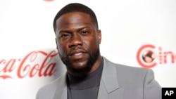 FILE - Kevin Hart, recipient of the CinemaCon international star of the year award, poses at the Big Screen Achievement Awards at Caesars Palace in Las Vegas, April 4, 2019.