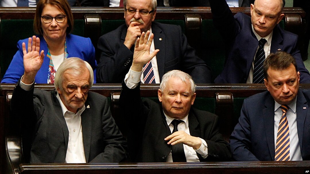 Poland's most powerful politician, ruling Law and Justice Party leader Jaroslaw Kaczynski, center, attends a vote in parliament in Warsaw, Dec. 8, 2017, in which lawmakers approved legislation that gives them control over the Supreme Court. The opposition and the European Union leaders say the legislation threatens the rule of law.