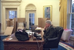 President Bill Clinton in the Oval Office on the day before he left office, January 19, 2001. (Clinton Library)