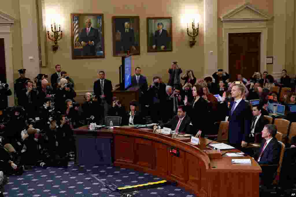 Former White House National Security aide Fiona Hill, and David Holmes, a U.S. diplomat in Ukraine, are sworn in to testify before the House Intelligence Committee on Capitol Hill in Washington during a public impeachment hearing of President Trump.