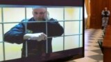 FILE PHOTO: Jailed Russian opposition leader Alexei Navalny is seen on a screen during a court hearing in Moscow