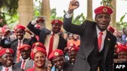 FILE - Singer turned politician Robert Kyagulanyi, also known as Bobi Wine, gestures during a press conference, held at his home in Magere in the outskirts of Kampala, July 24, 2019.