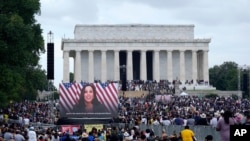 A screen displays a video with Democratic vice presidential candidate Kamala Harris speaking during the March on Washington, Aug. 28, 2020, at the Lincoln Memorial in Washington.
