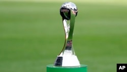FILE - A view of the trophy displayed on the pitch prior to the final match between Ukraine and South Korea at the U20 World Cup soccer, in Lodz, Poland, Saturday, June 15, 2019.